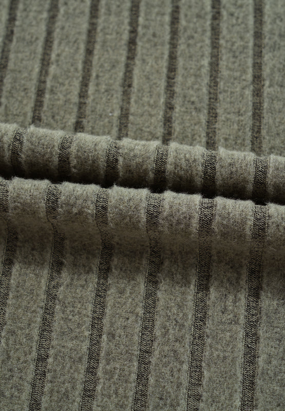 Ribbed knit top in army green with subtle dark stripes and a cutout detail.
