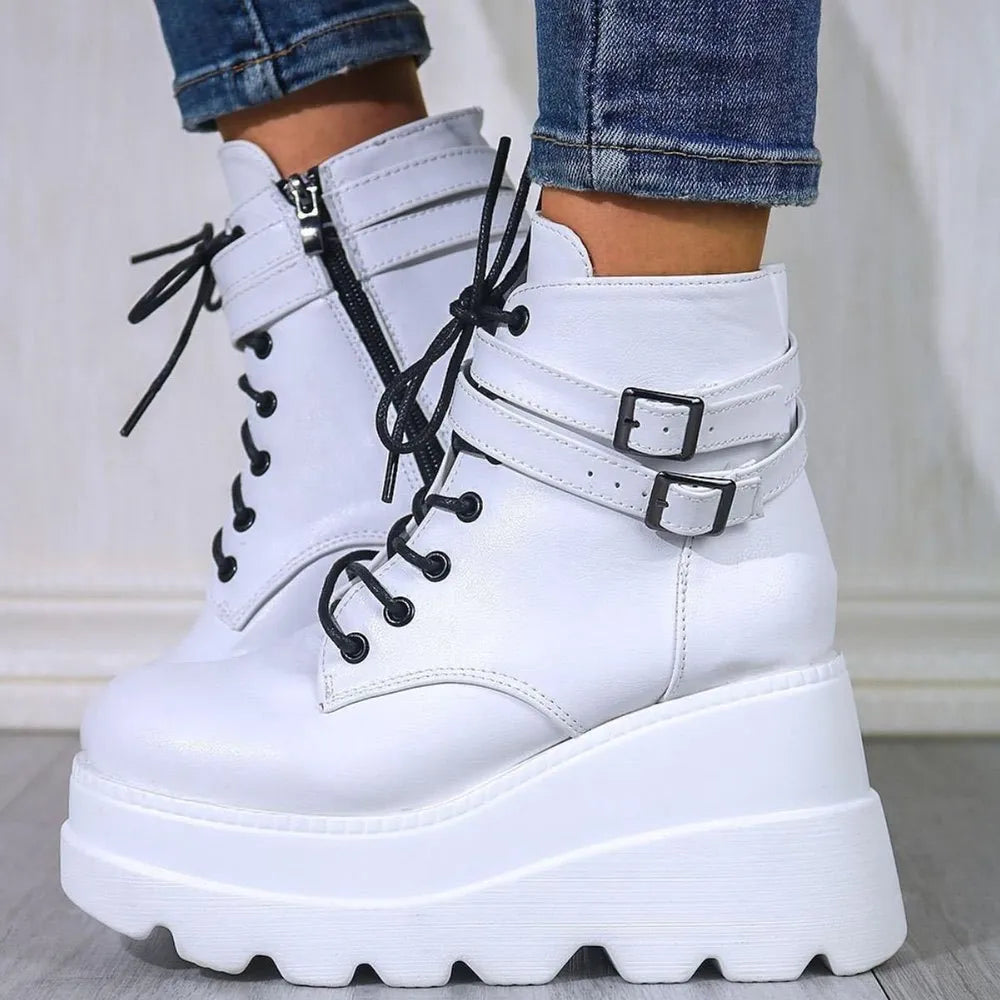 White platform buckle lace-up booties with side zipper and chunky sole.