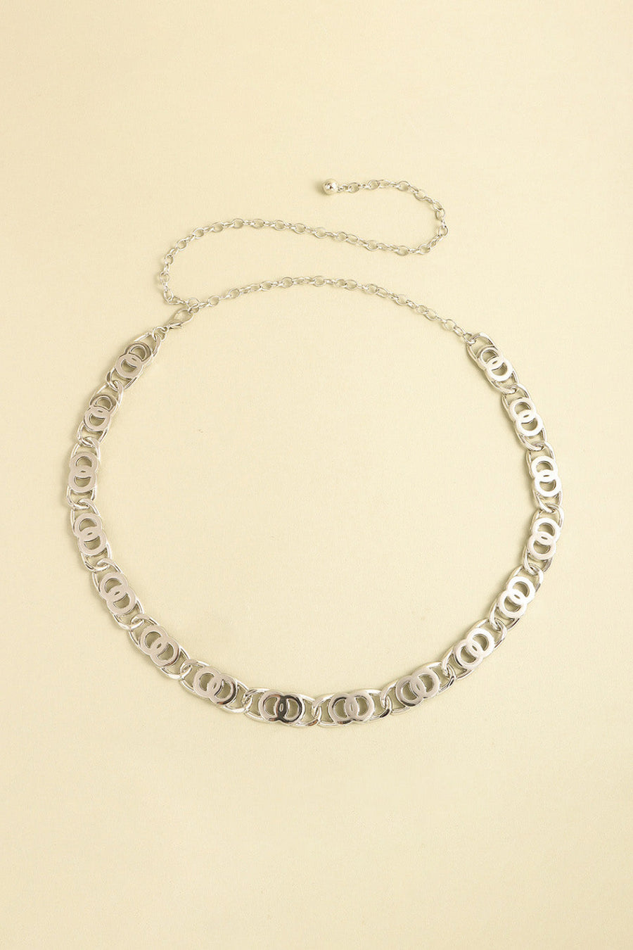 Silver chain belt with interlocking circle links and adjustable extender chain.