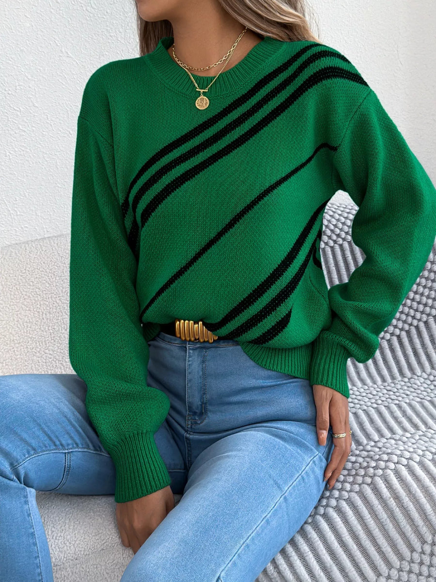 Green acrylic blend sweater with black diagonal stripes, round neck, and long sleeves.