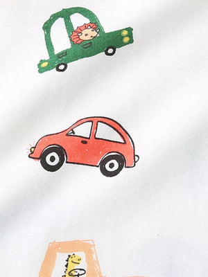 White cotton t-shirt with a whimsical cartoon car print featuring a lion in a green car and a red car.