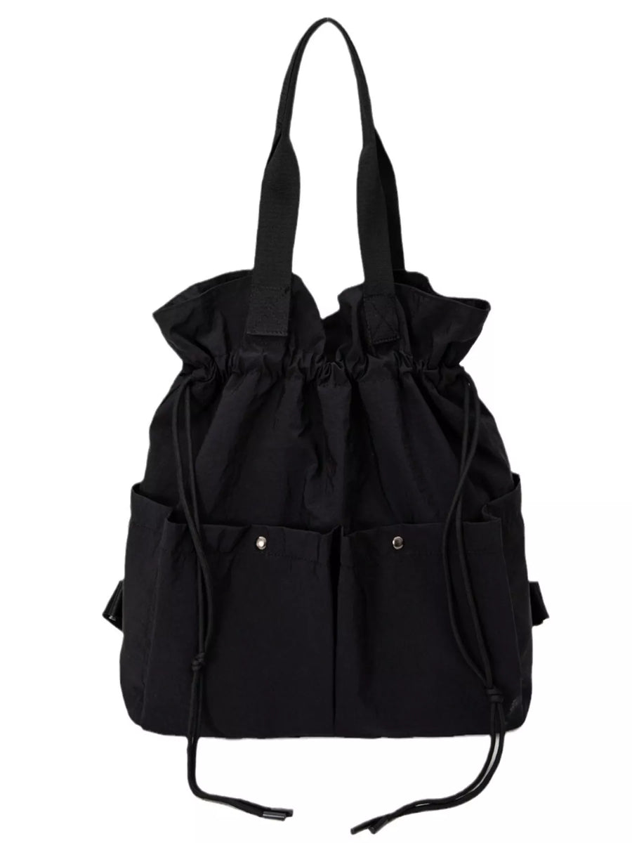 Black drawstring backpack with multiple exterior pockets and shoulder straps.