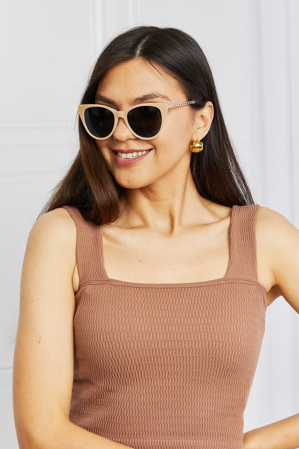 Cat-eye acetate sunglasses in mocha with chain detail on temples.
