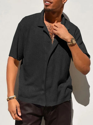 Black perforated knit resort shirt with short sleeves and a spread collar.