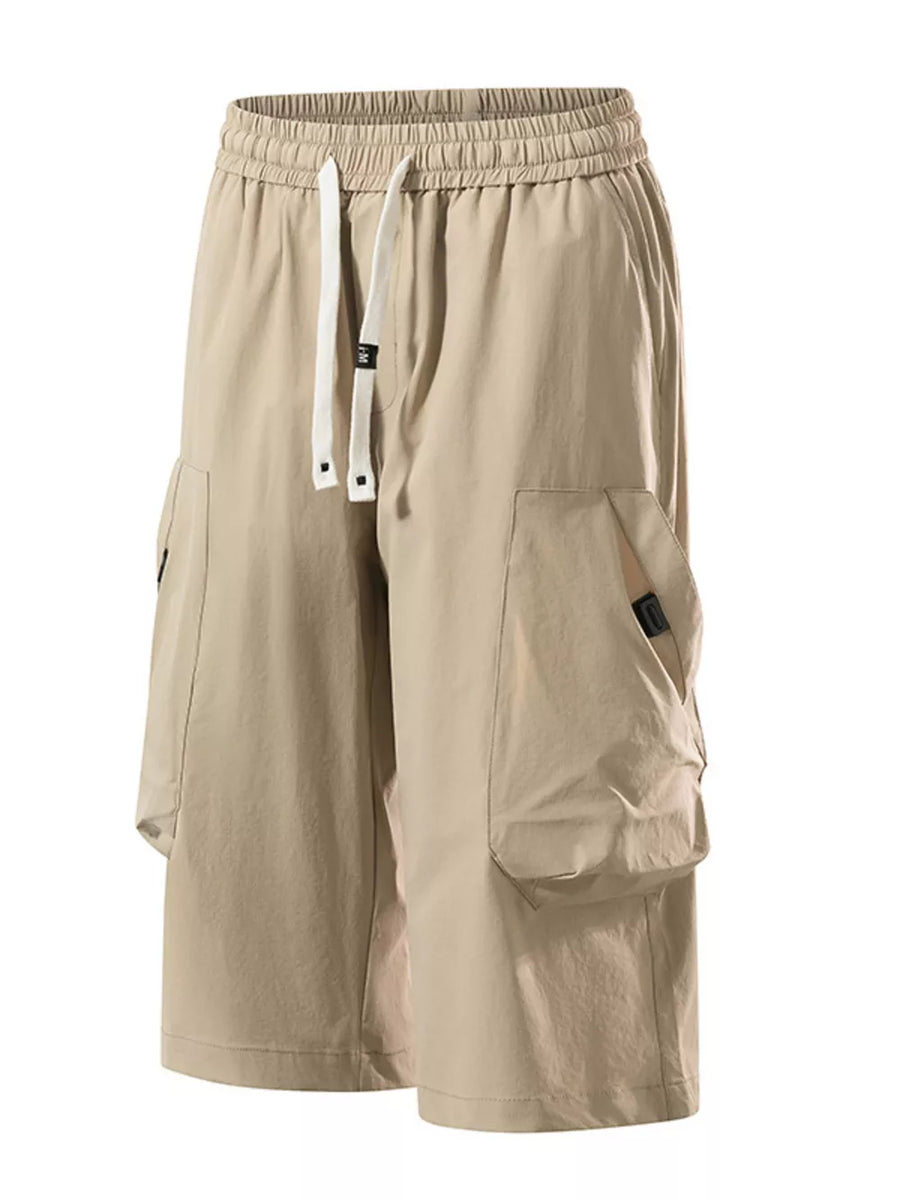 Khaki cargo capris with adjustable drawstring and large side pockets.