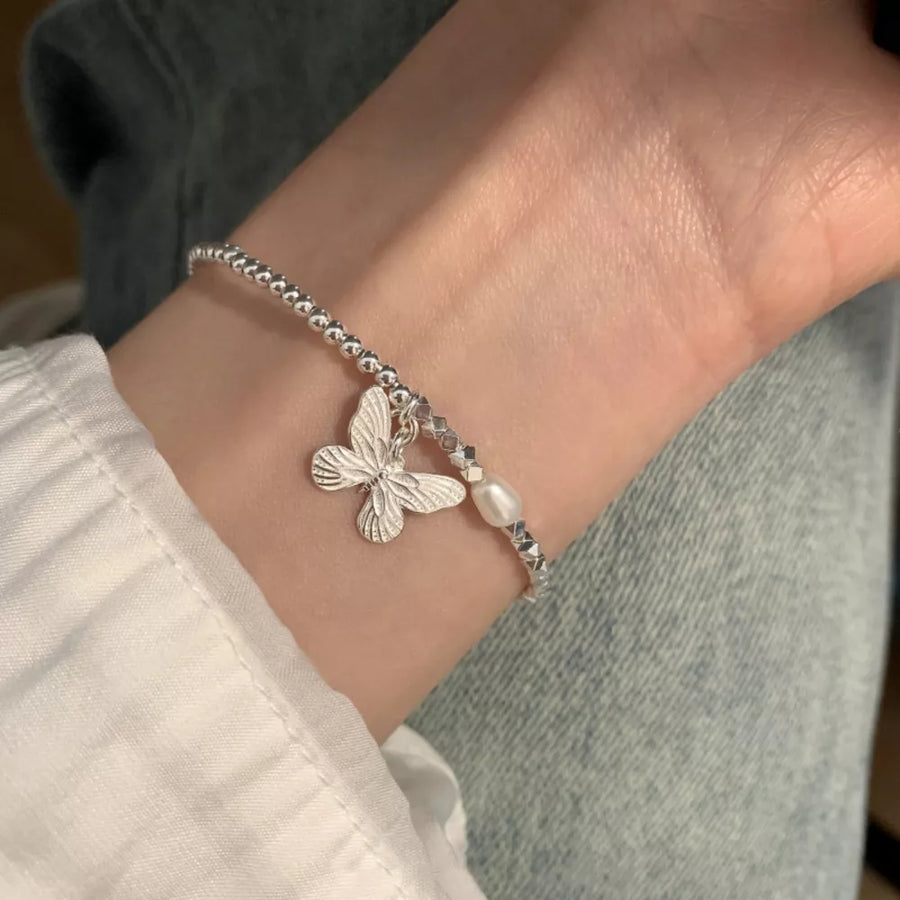 Freshwater Pearl,925 sterling silver Care instructions: Avoid wearing during exe bracelet in Silver with jewelry silhouette
