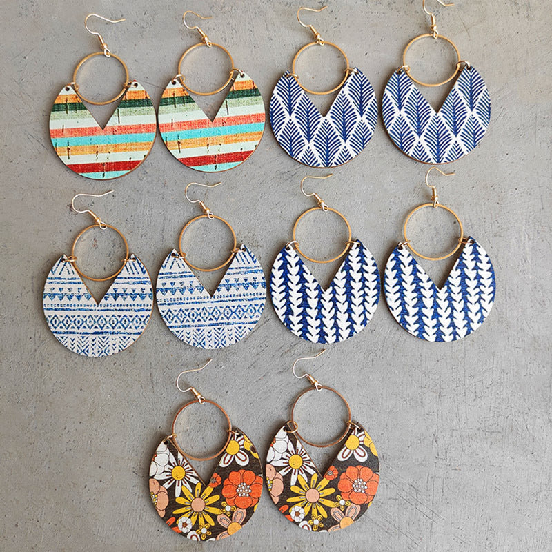 Geometric striped wood drop earrings in multiple patterns and colors, including floral and tribal prints.
