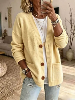 cardigan in pale yellow featuring buttoned and relaxed fit