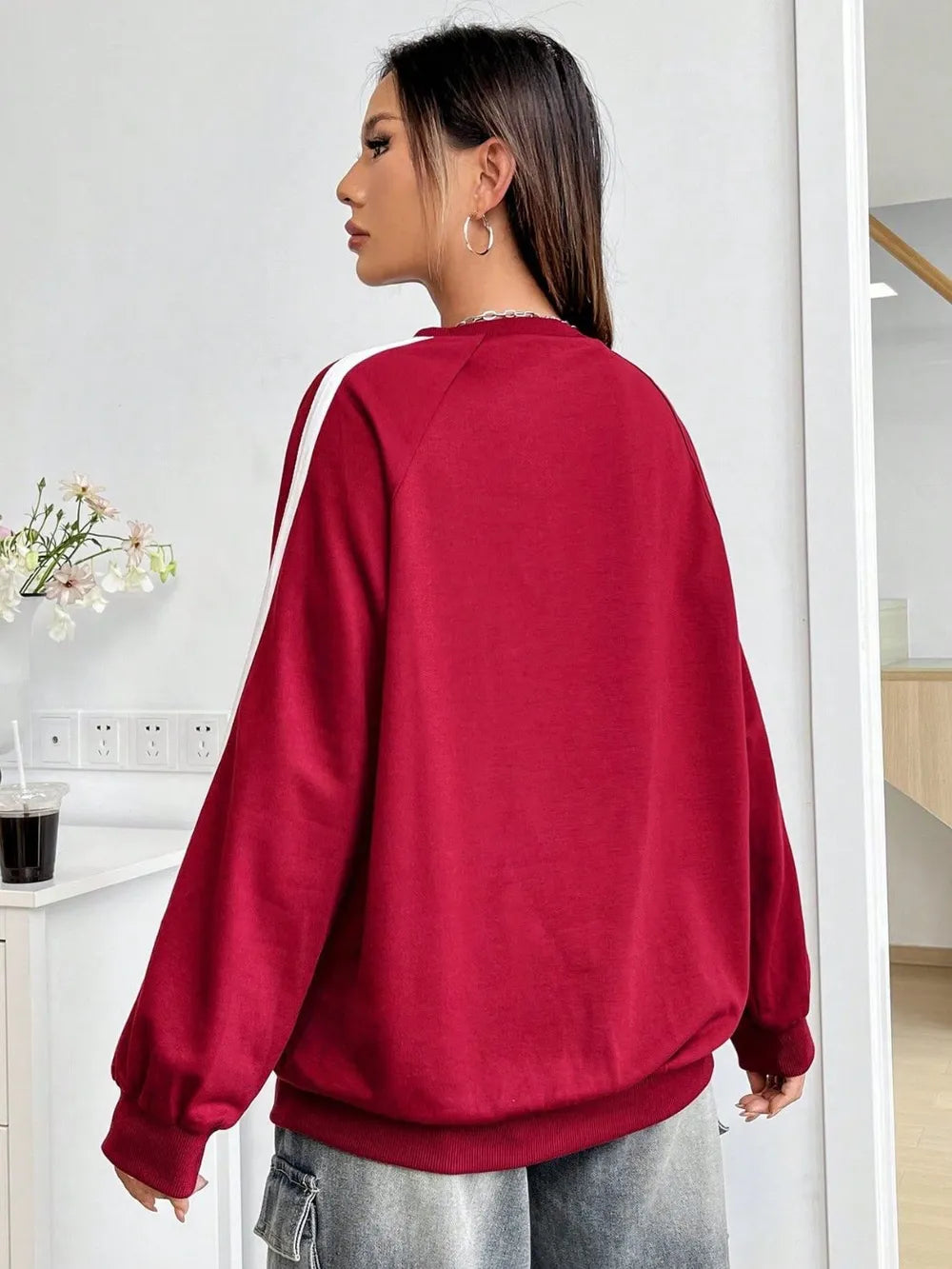 Deep Red raglan sleeve sweatshirt with white shoulder stripes and crewneck.