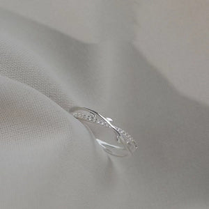 Sterling silver crossover ring with delicate pave crystal accents