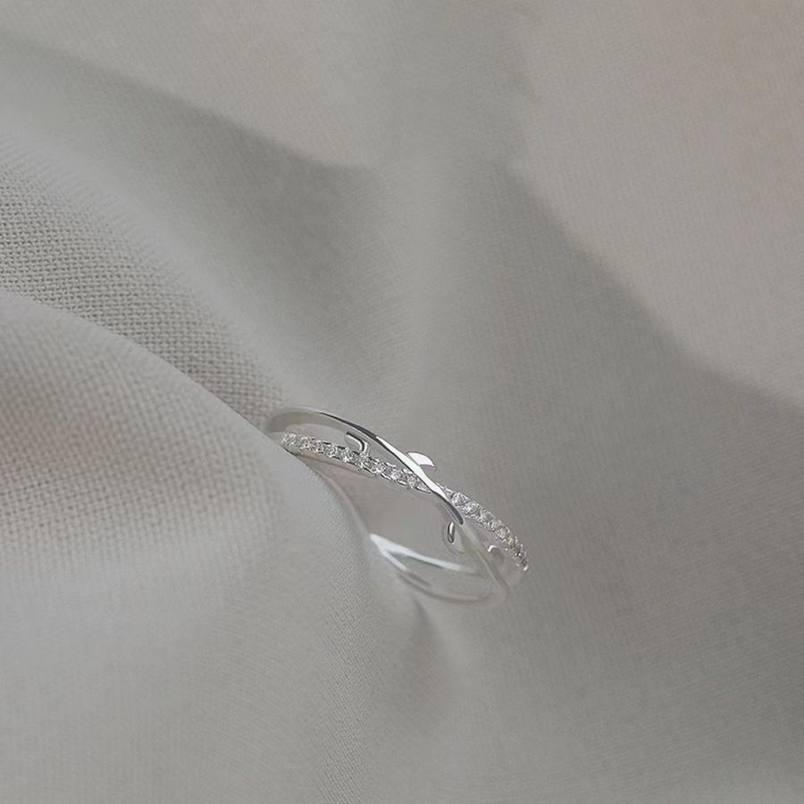 Sterling silver crossover ring with delicate pave crystal accents