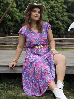 Vibrant floral maxi dress with cap sleeves, cinched waist, and tiered skirt.