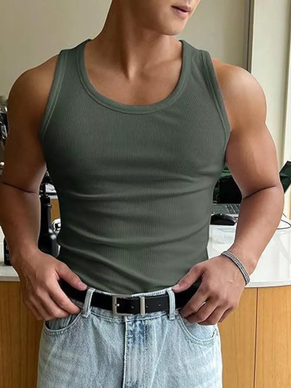 Men's ribbed tank top in green, with a crew neck and body-hugging fit.