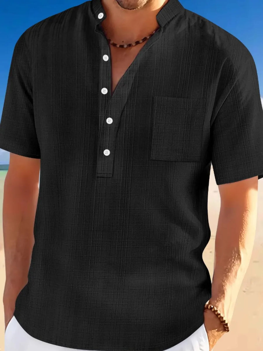 Black textured linen henley shirt with short sleeves and a chest pocket.