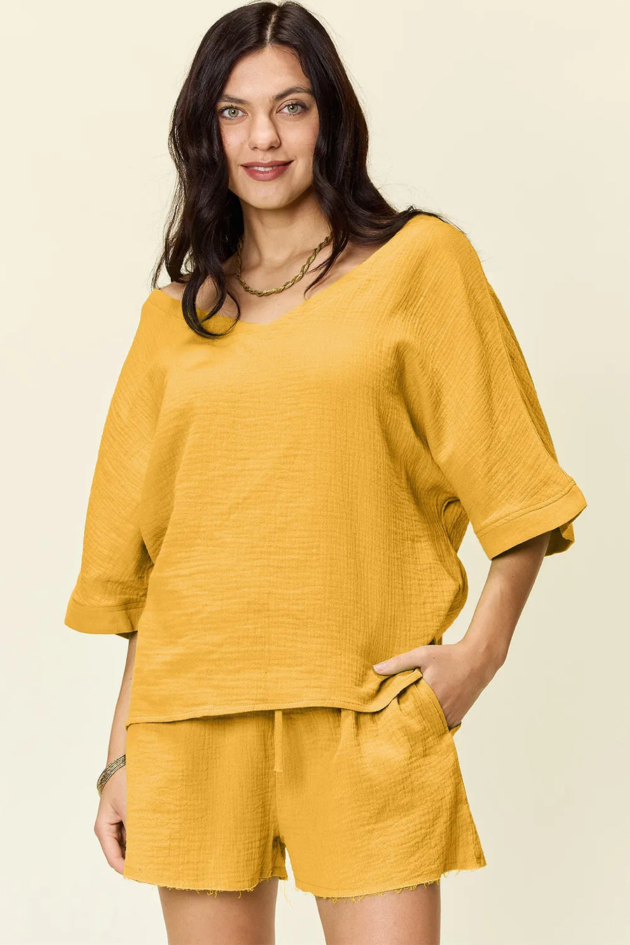 Gold textured cotton half sleeve top with V-neck and drawstring shorts set
