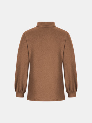 Camel button-back mock neck top with puff sleeves.