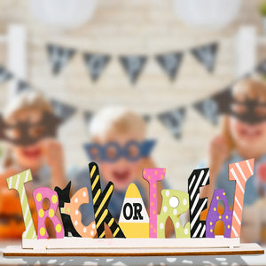 Halloween word block trio with Trick or Treat text in assorted colorful patterns and styles.