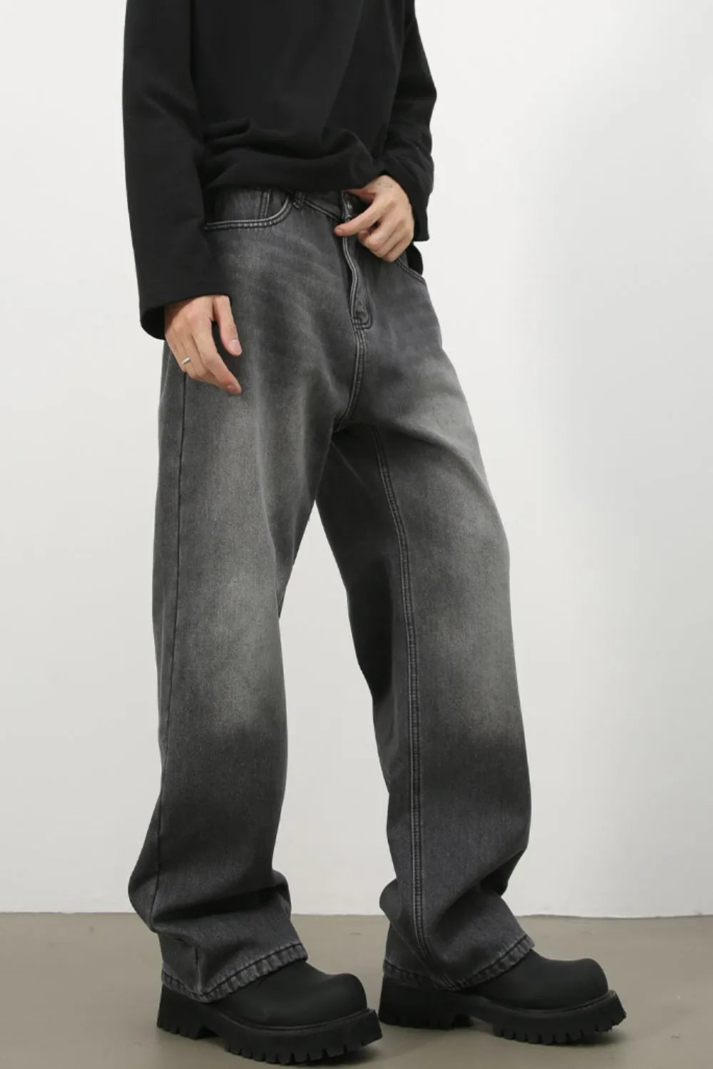 Faded dark gray cotton denim jeans with a wide-leg silhouette.