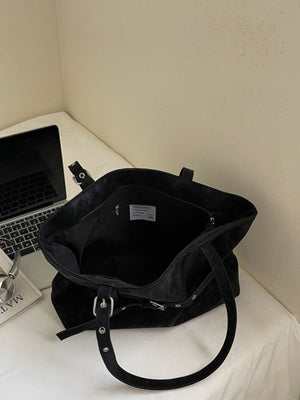 shoulder bag in black with buckle detail and medium