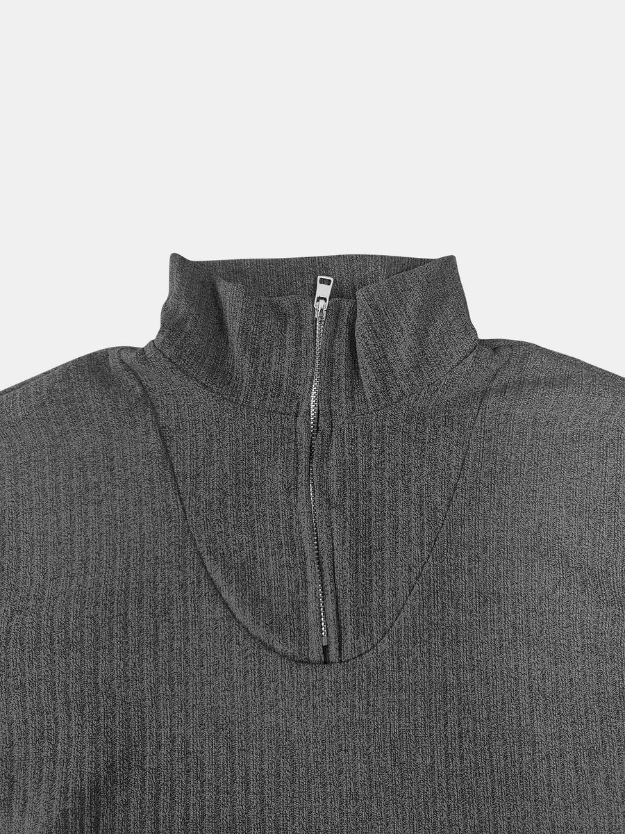 Dark gray ribbed knit quarter-zip pullover sweater with a mock neck.