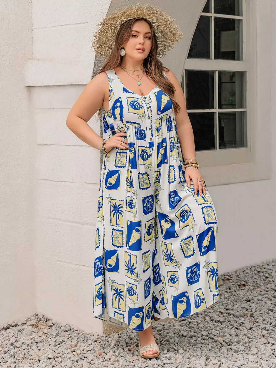 Plus-size relaxed jumpsuit with nautical print, V-neck, button front, and wide legs.