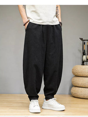 Men's black relaxed fit sweatpants with pockets, comfortable casual style.