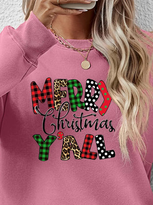 Blush pink crewneck sweatshirt with festive mixed print "Merry Christmas Y'all" graphic.