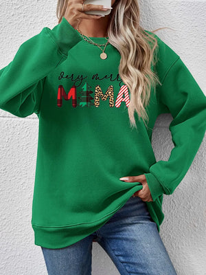 Green long sleeve sweater with abstract Christmas graphic print and crew neck.