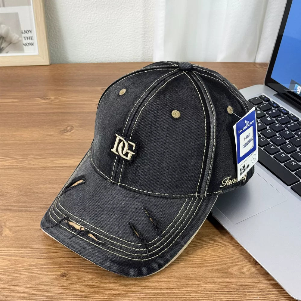 Black distressed denim baseball cap with gold DG logo and contrast stitching