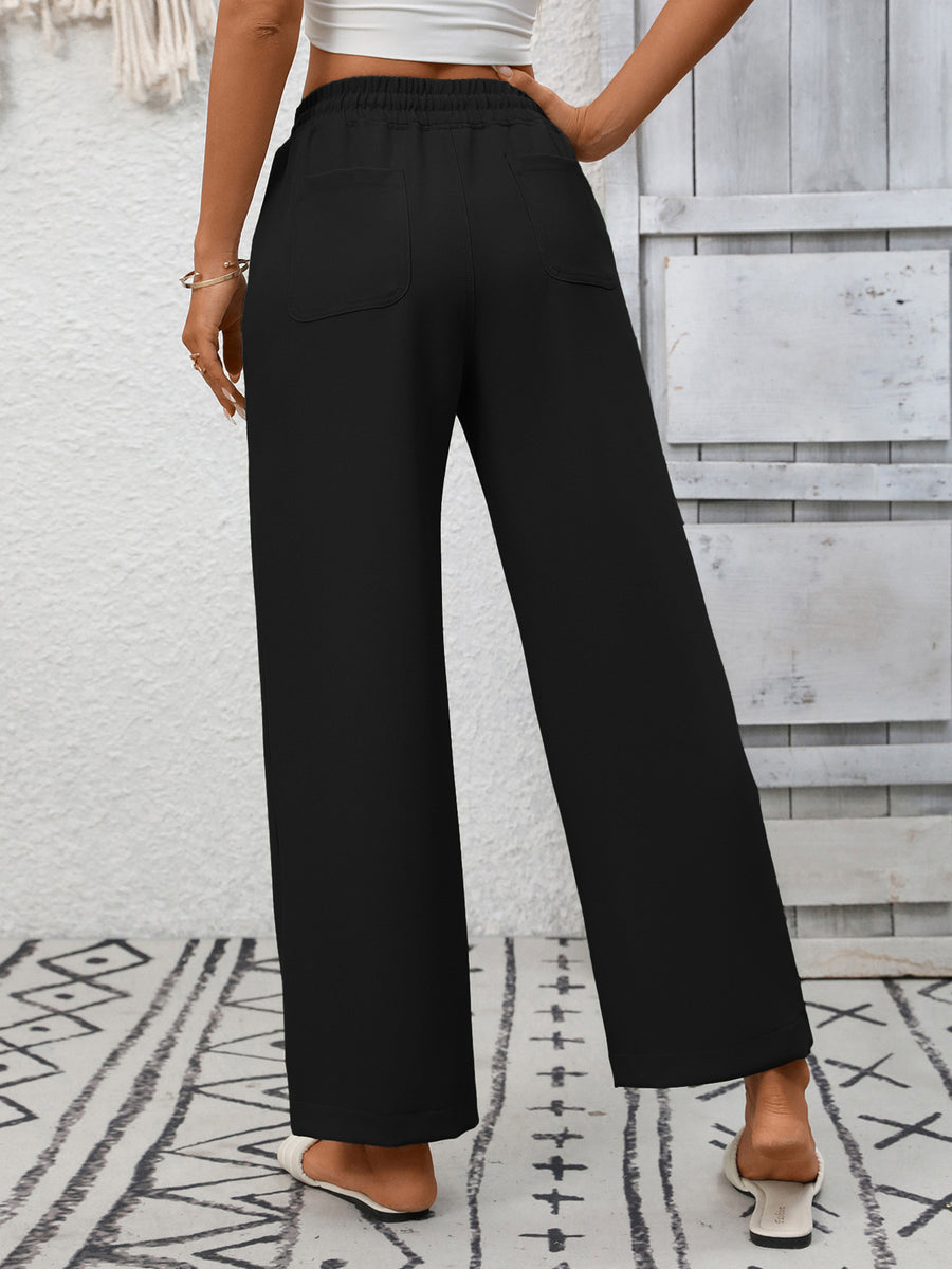 Black drawstring wide-leg pants with back pockets and a relaxed fit.