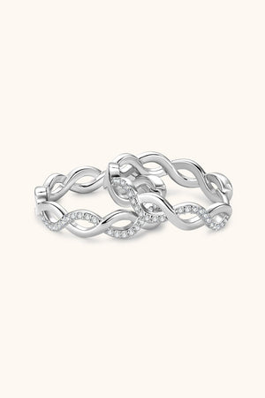 Silver braided pavé hoop earrings with a twisted infinity design.