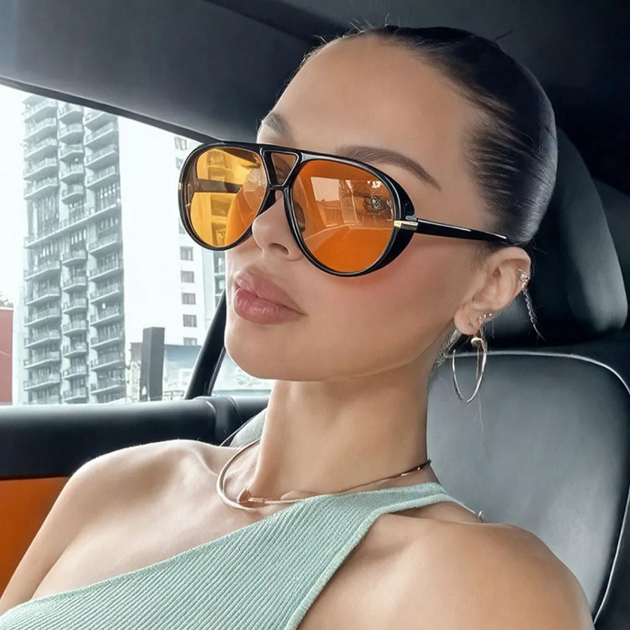 sunglasses in black featuring UV protection and oversized fit