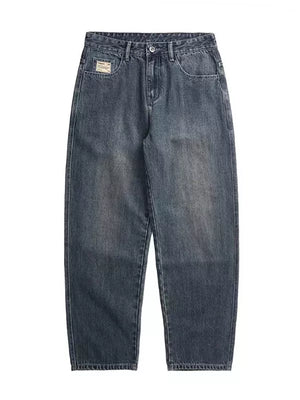Relaxed fit vintage wash jeans in blue denim with a subtle faded effect.