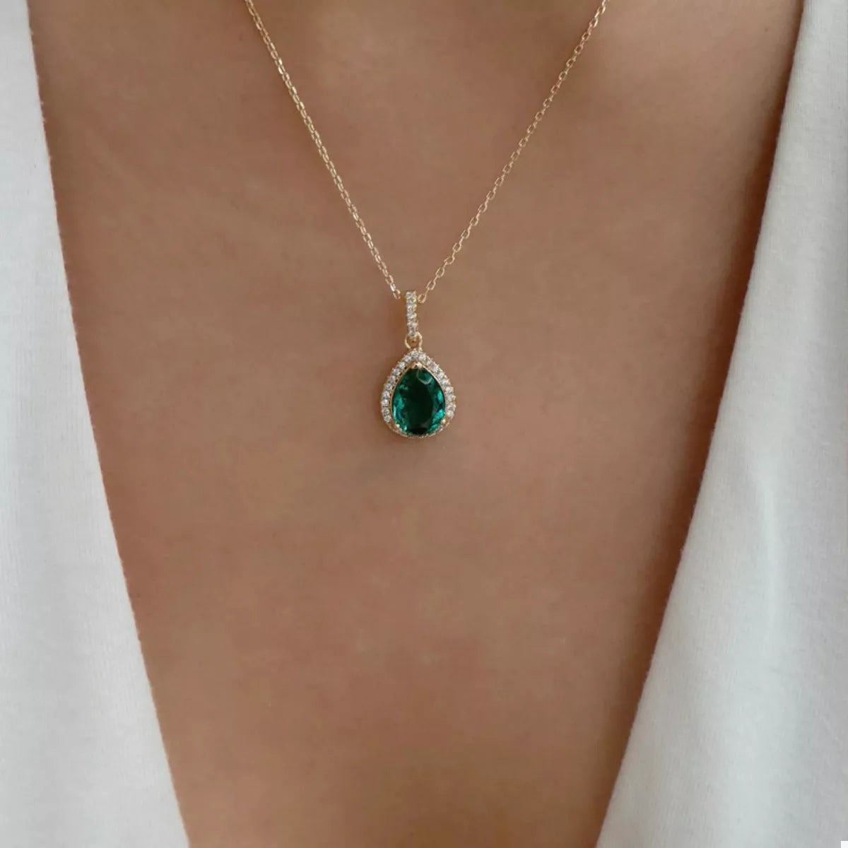 18K gold-plated necklace with dark green teardrop pendant and crystal accents