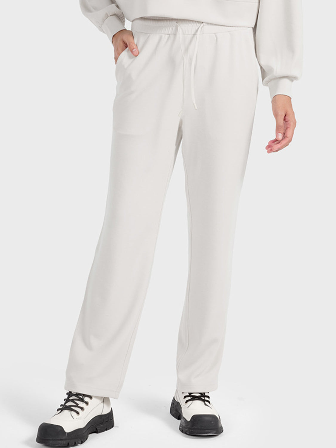 Ivory Galaxy Drawstring Tech Joggers with pockets and a relaxed fit.
