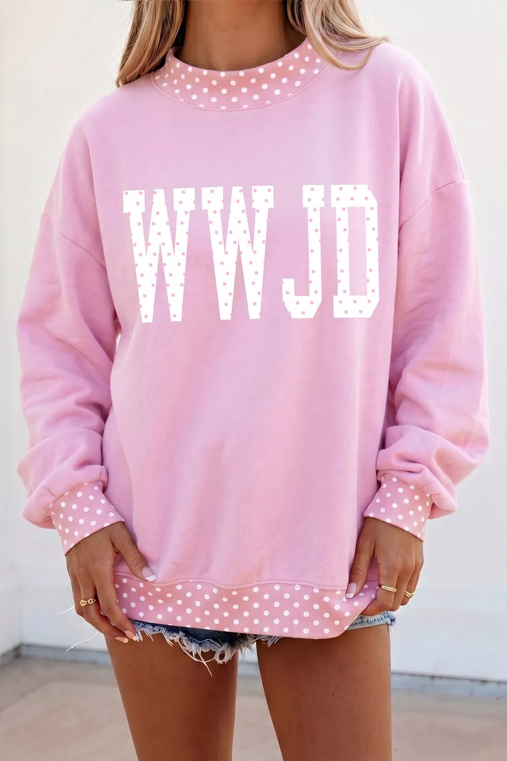light pink sweatshirt with polka dot and mock neck