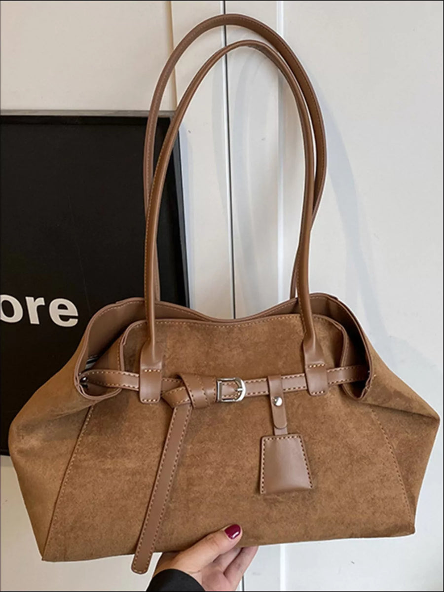 Brown suede shoulder bag with buckle detail and twin straps
