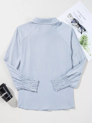 Blue and white striped collared shirt with ruched cuffs and long sleeves