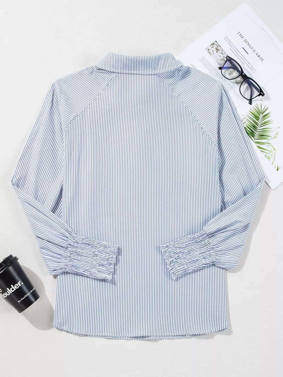 Blue and white striped collared shirt with ruched cuffs and long sleeves