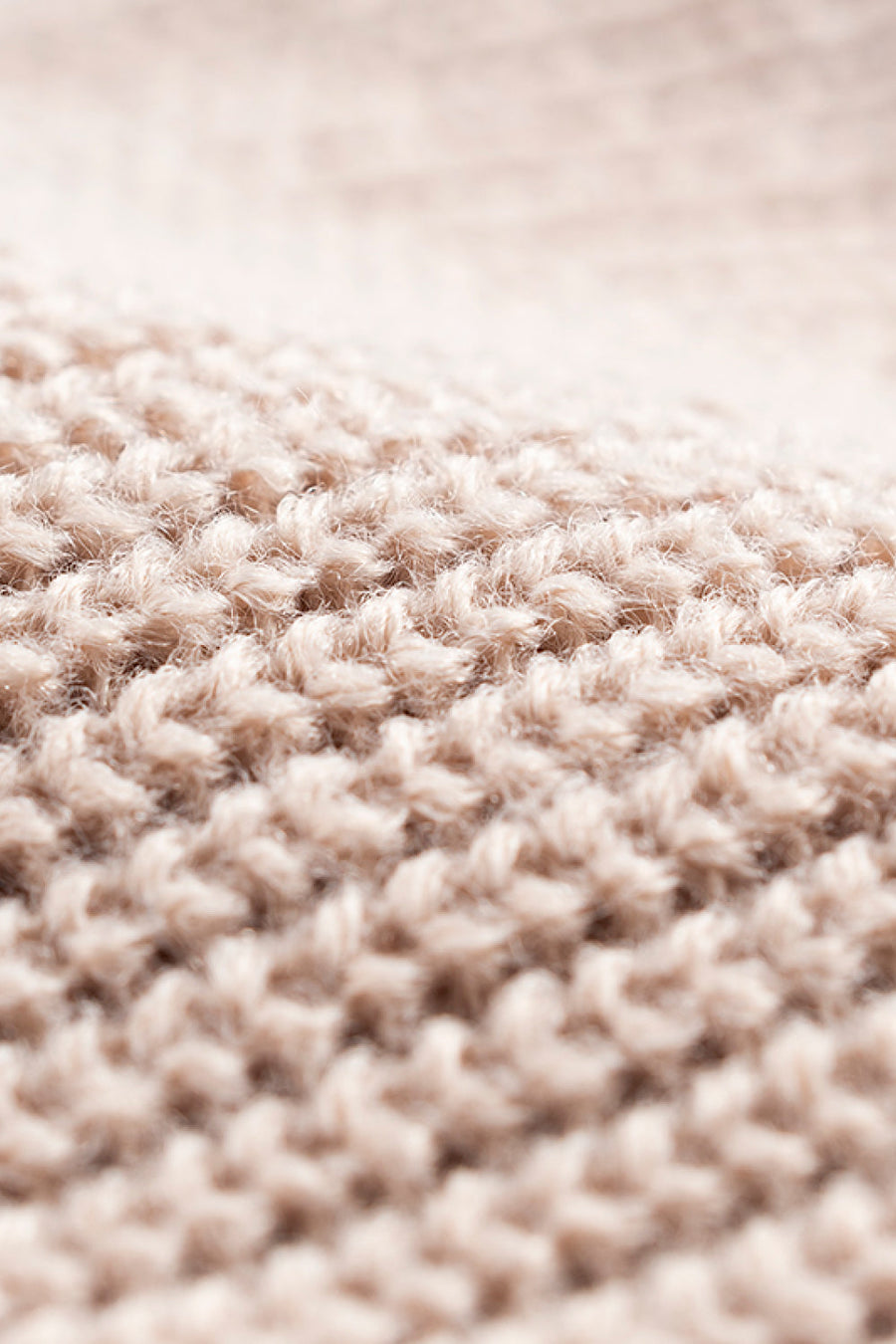 Tan ribbed knit beanie with a fuzzy acrylic texture
