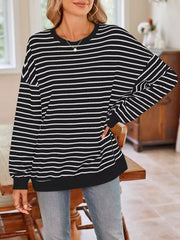 white sweatshirt featuring stretch and striped