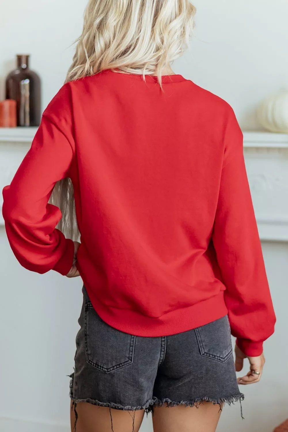 65% polyester, 35% cotton Care instructions: Machine wash cold sweatshirt in Black with relaxed silhouette