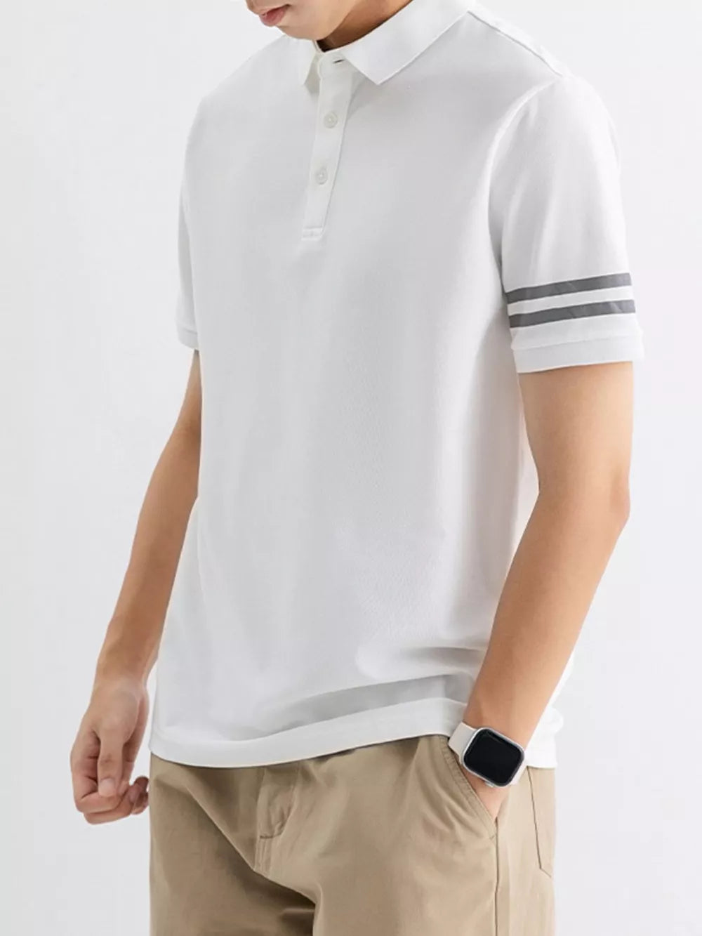 White cotton polo shirt with grey striped sleeves and a classic collar.
