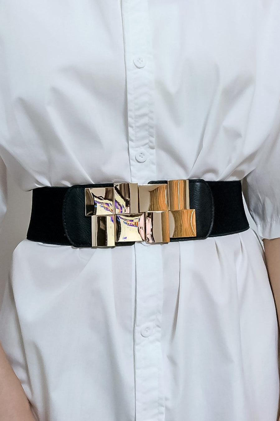 Black stretch belt with geometric gold buckle accent