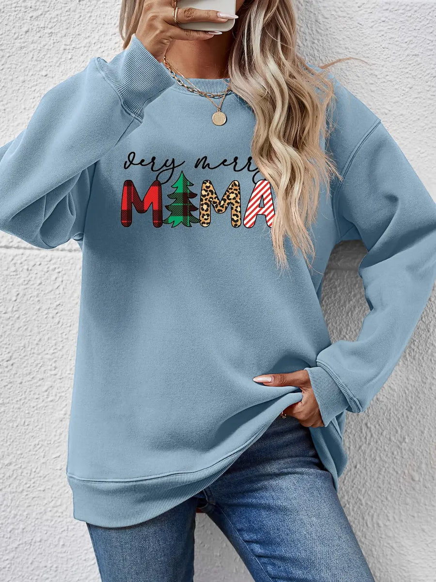 Misty Blue long sleeve sweater with "very merry MAMA" graphic in plaid, trees, leopard, and stripes.