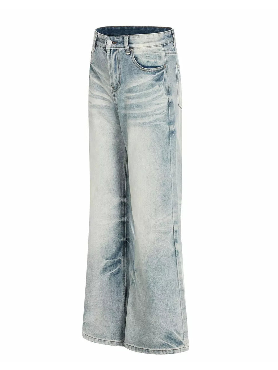 Men's light blue vintage wash wide leg jeans with distressed details