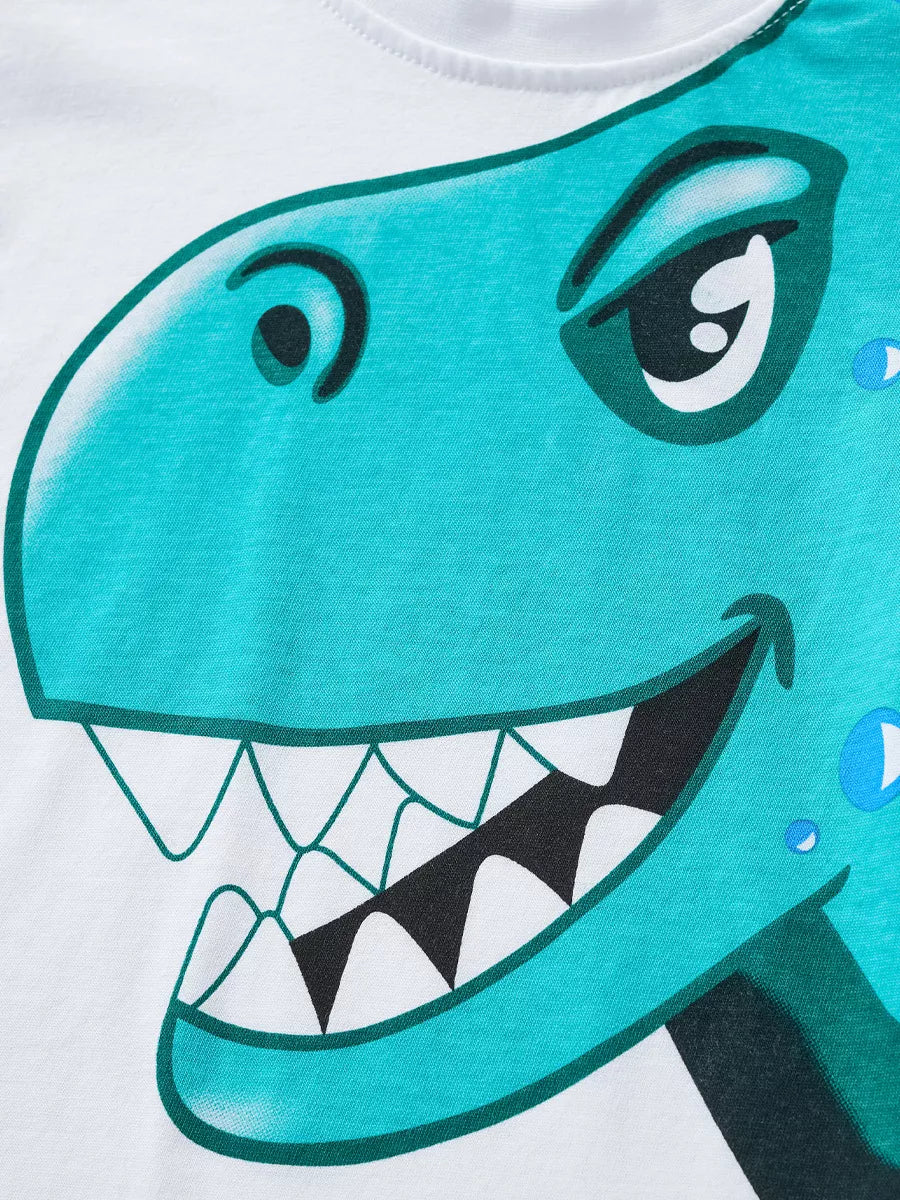 White t-shirt with a teal dinosaur graphic, featuring sharp teeth and a playful expression.