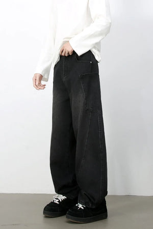 Black denim baggy trousers with a relaxed fit and large front pockets.