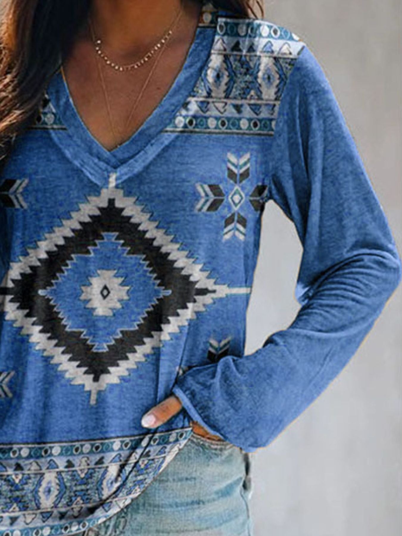 Blue long sleeve v-neck t-shirt with geometric tribal print