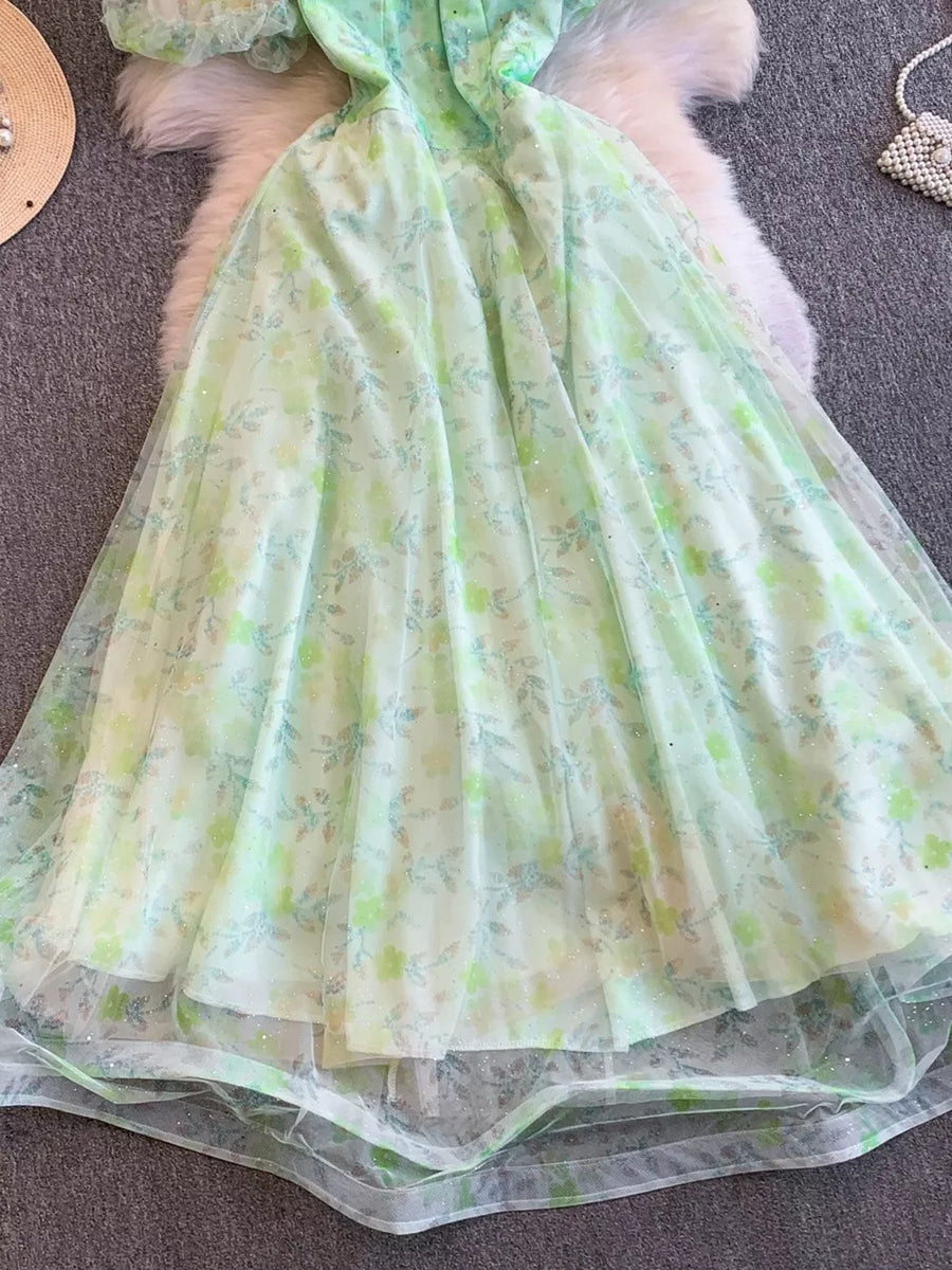 Green floral maxi dress with sweetheart neckline and lace details.